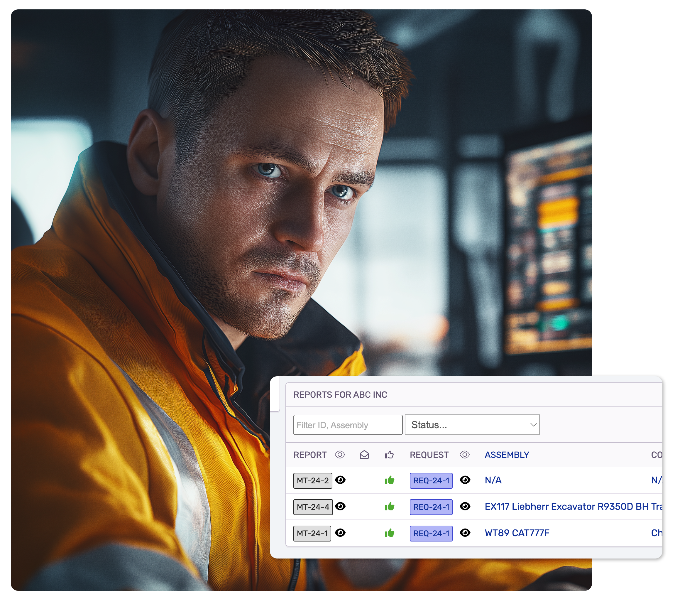 a man in a work wear looking at a computer screen in an industrial office setting